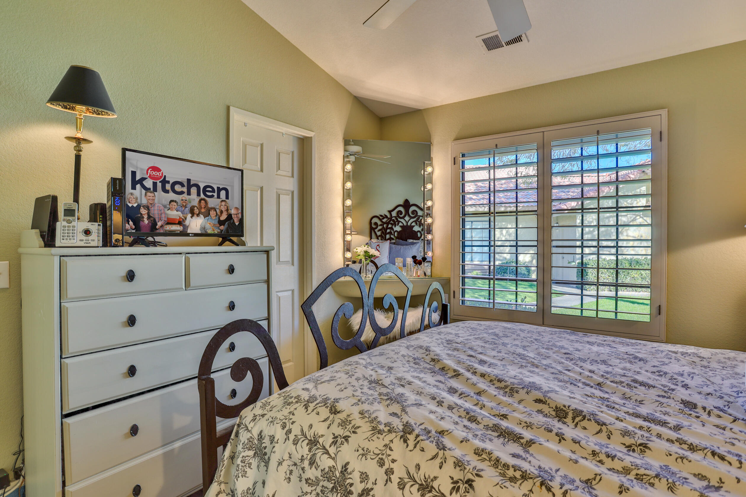 42895 Scirocco Road Palm Desert, CA 92211 - Photo 29 of 64 a bedroom with a bed and a window