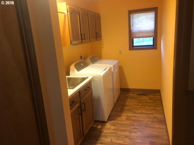 7635 Southeast Barbara Welch Road Portland, OR 97236 - Photo 13 of 26 a utility room with a sink