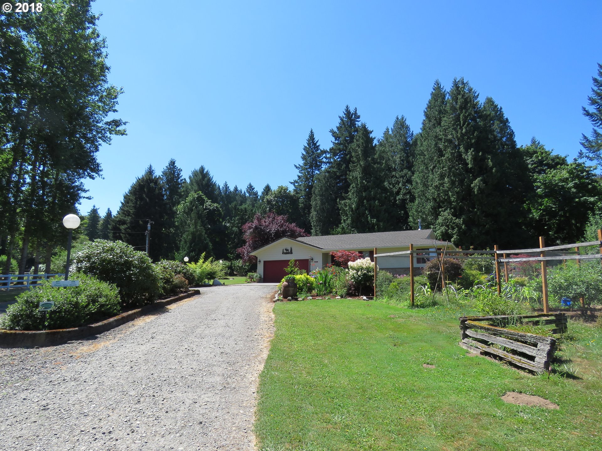 7635 Southeast Barbara Welch Road Portland, OR 97236 - Photo 26 of 26 a view of a garden with sitting area