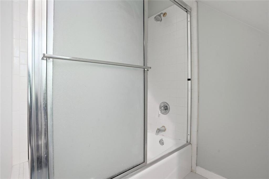 3259 Etchison Road Loganville, GA 30052 - Photo 32 of 50 a bathroom with a bathtub and a shower