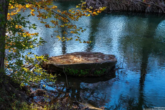 a view of a swimming pool with an outdoor space and seating area