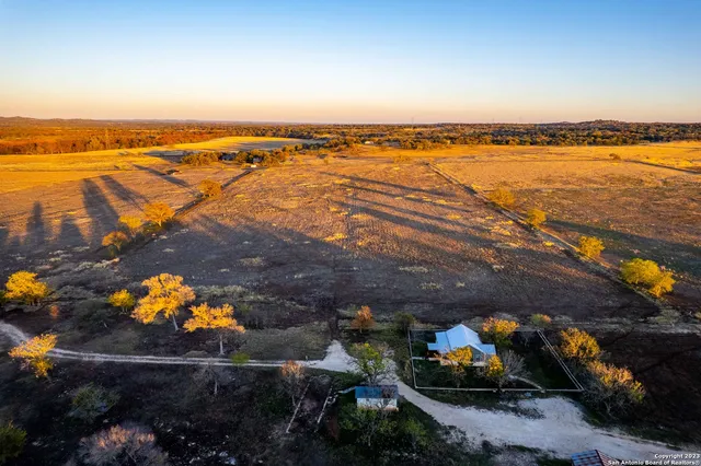 a view of a dry yard with mountain