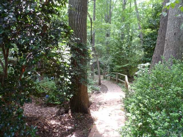 2008 Rangecrest Road Raleigh, NC 27612 - Photo 5 of 10 and brick walkway all the way through the adjoining lot, which is full of azaleas.