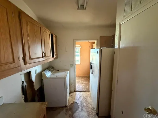 a kitchen with stainless steel appliances a refrigerator and cabinets