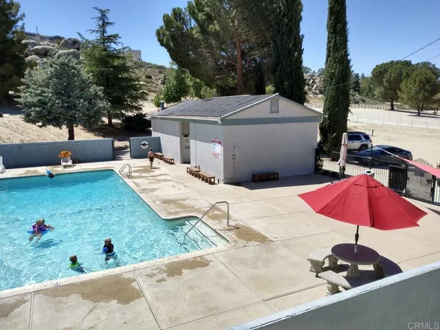 an outdoor space with furniture and umbrella