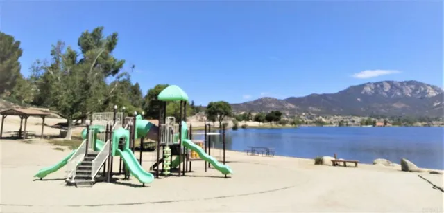 a view of outdoor space with swimming pool and lake view