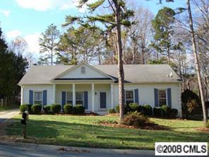 9617 Riddick Place Matthews, NC 28105 - Photo 1 of 8 a front view of a house with a yard