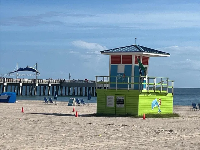 a view of a park with large trees