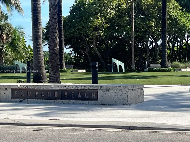 a view of a swimming pool with an outdoor seating