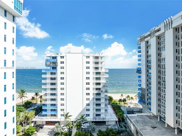 a view of buildings with glass windows