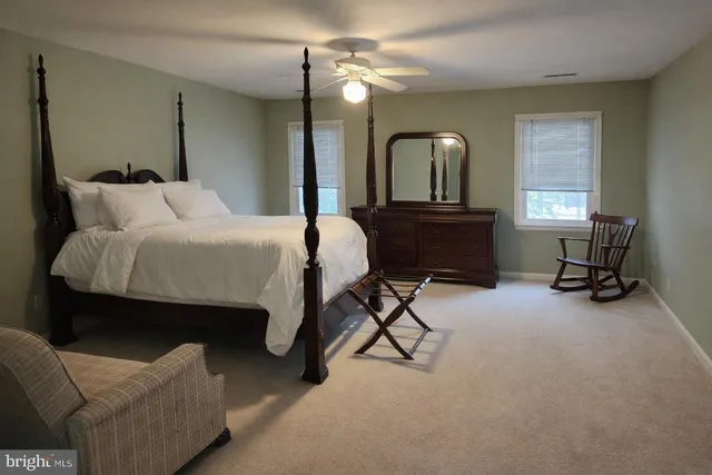 a bathroom with a sink vanity and a mirror