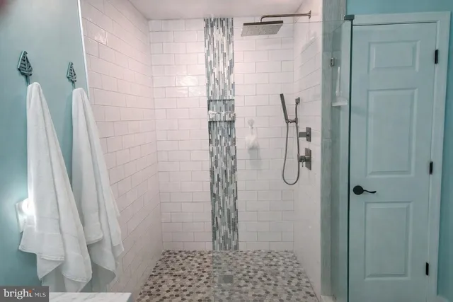 a bedroom with a bed dresser and a window