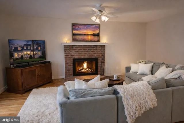 a living room with furniture and a piano