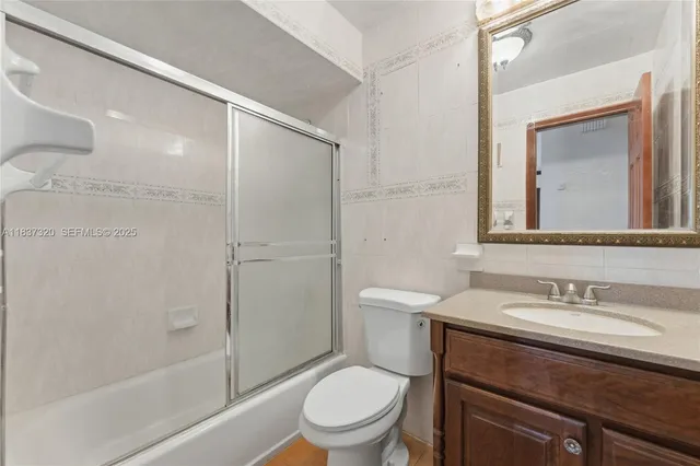 a bathroom with a toilet a sink and a bathtub