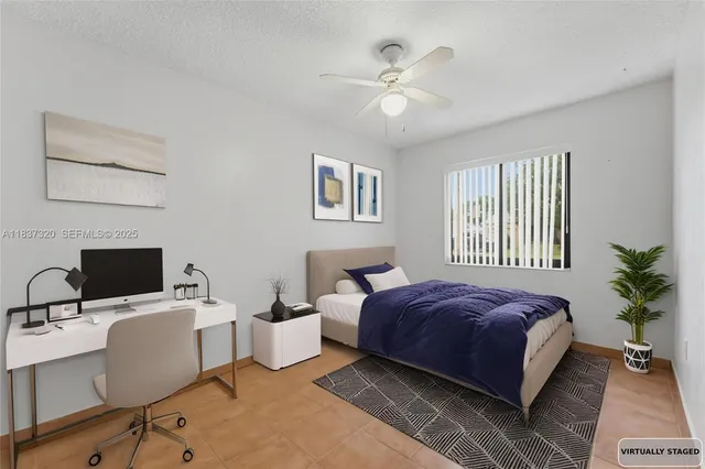 a bedroom with a bed and a desk