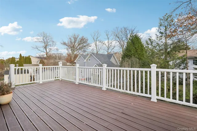 a view of a balcony with wooden floor