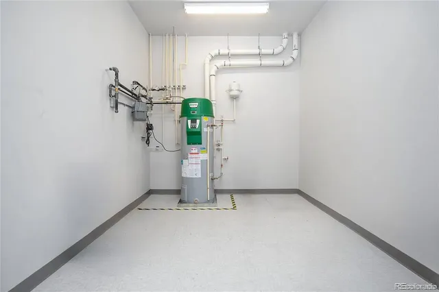 a view of empty room with a sink and cabinet