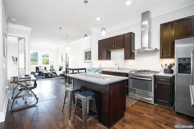 a kitchen with counter top space a sink appliances and cabinets