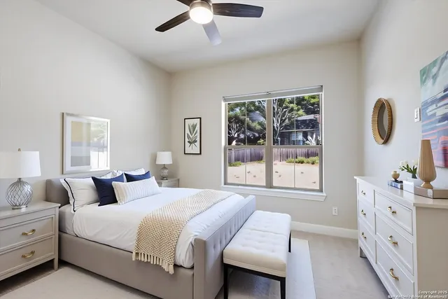 a bedroom with a large bed and a window