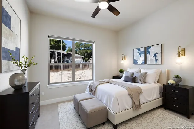 a bedroom with bed and a window