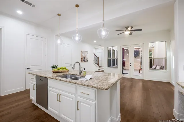 a view of a kitchen counter space with wooden floor