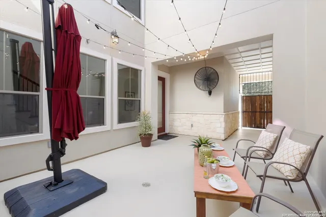 a view of hall way with furniture