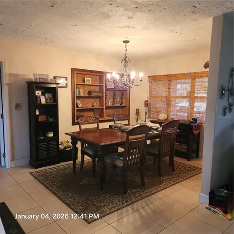 a bedroom with a bed window and walk in closet