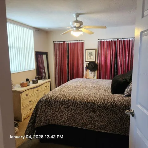 a bedroom with a bed and window