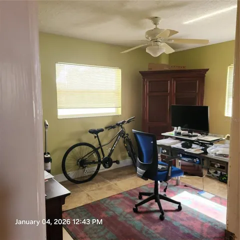 a bathroom with a sink a mirror and a window