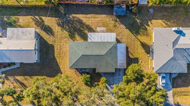an aerial view of a house with swimming pool