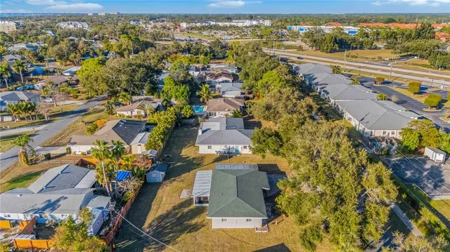 an aerial view of residential houses with outdoor space