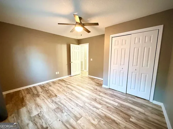 a bathroom with a toilet and a bathtub
