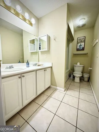 a view of a room with a ceiling fan