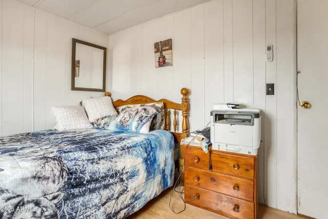 a bedroom with a bed and a closet