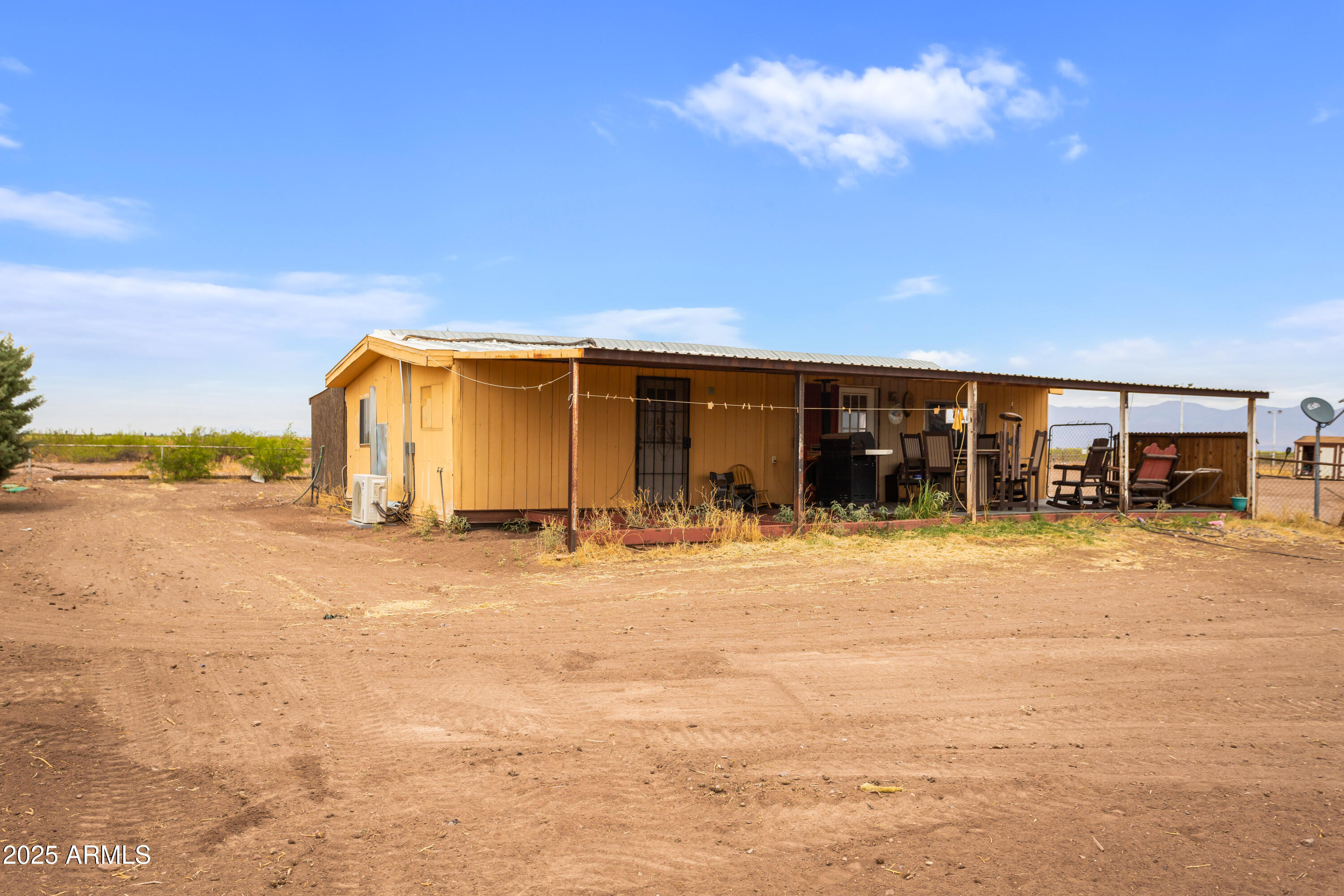 4274 West Lee Road McNeal, AZ 85617 - Photo 20 of 43 a view of a house next to a yard with big trees