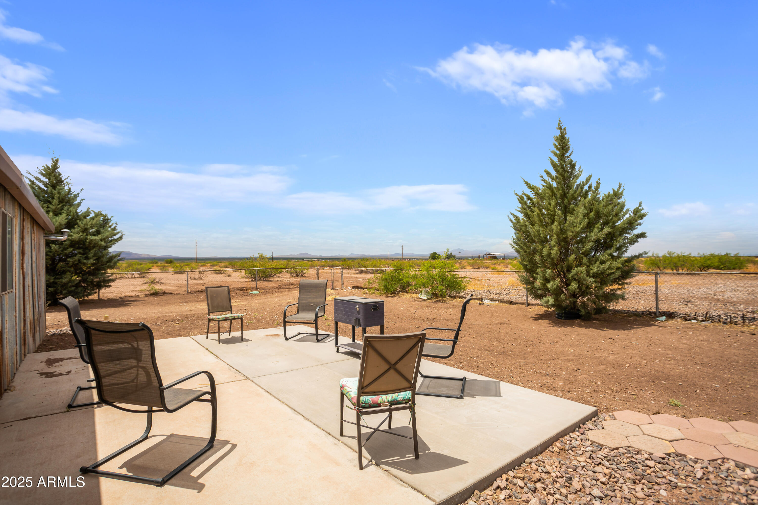 4274 West Lee Road McNeal, AZ 85617 - Photo 25 of 43 a view of a terrace with furniture and a potted plant