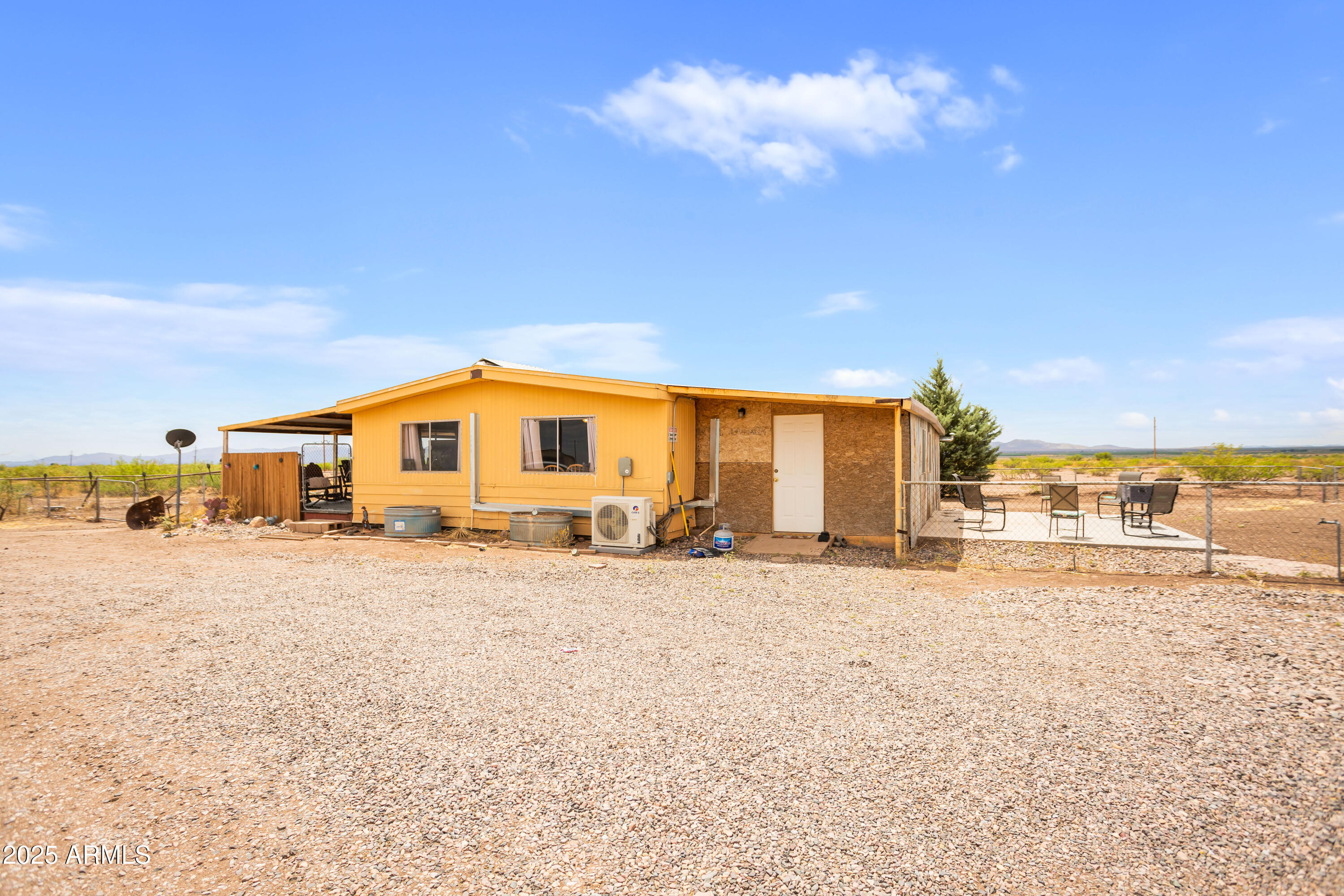 4274 West Lee Road McNeal, AZ 85617 - Photo 26 of 43 a view of a house with a big yard and large trees
