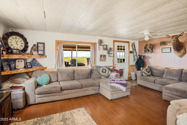 a living room with furniture and a large window