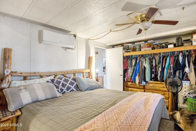 a bedroom with a bed and a walk in closet