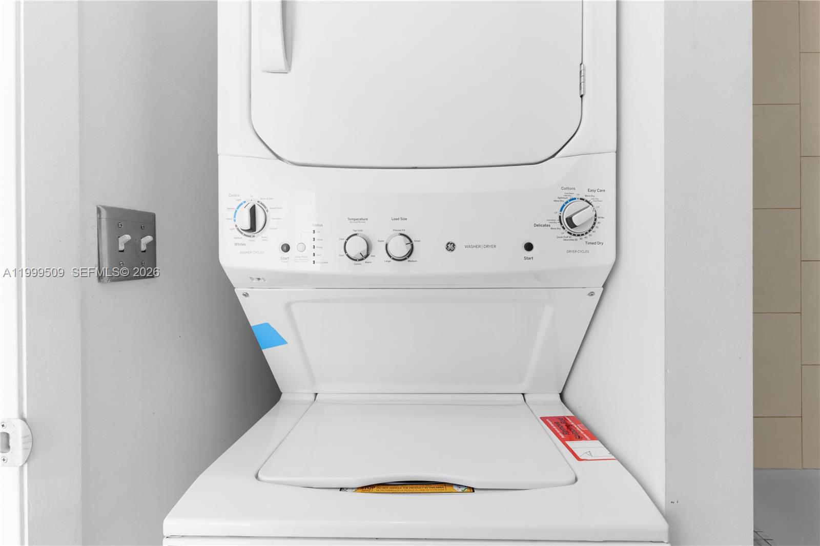 8101 Biscayne Boulevard, Unit R414 Miami, FL 33138 - Photo 18 of 27 a utility room with dryer and washer