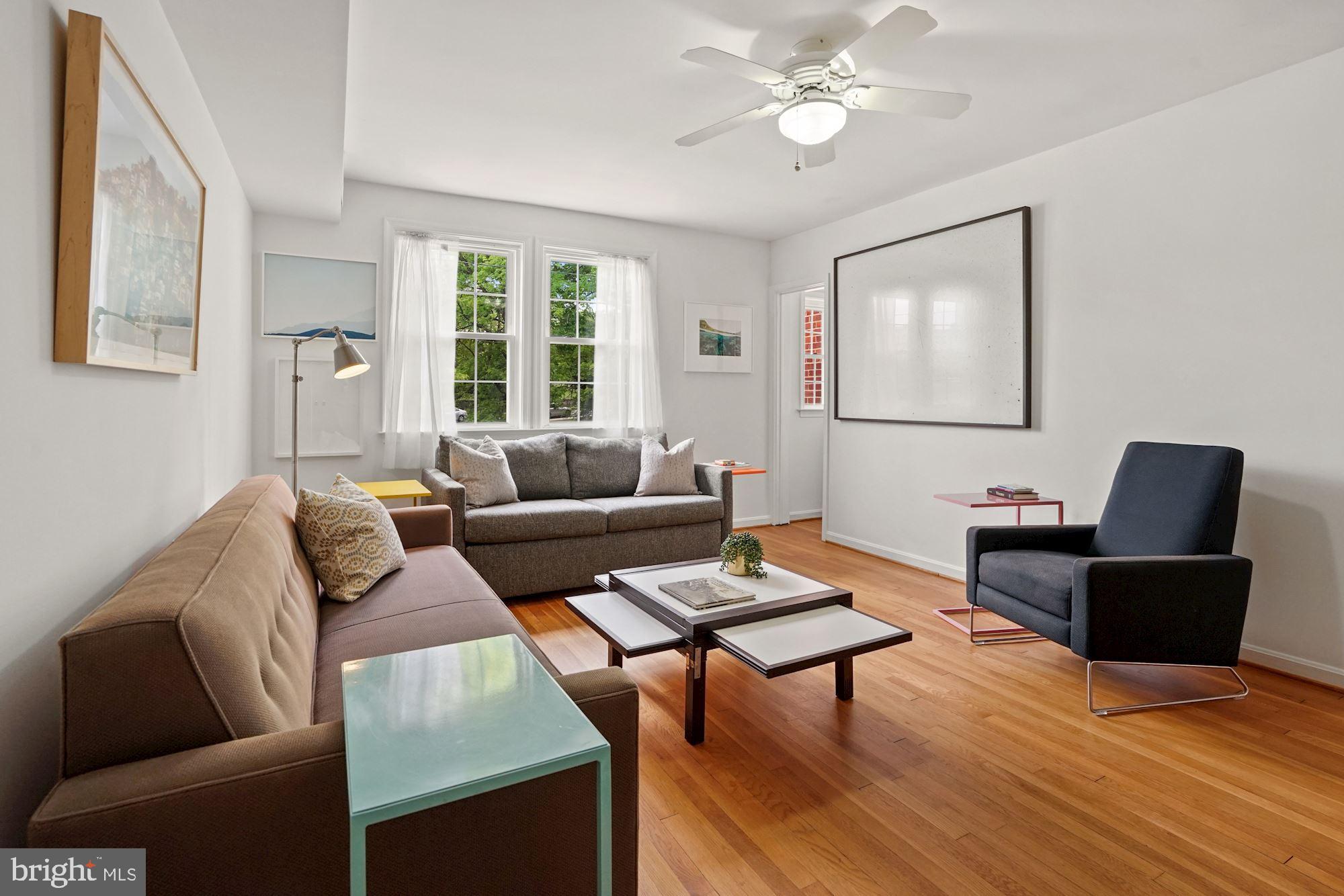 9 Russell Road, Unit D Alexandria, VA 22301 - Photo 19 of 29 a living room with furniture and a large window