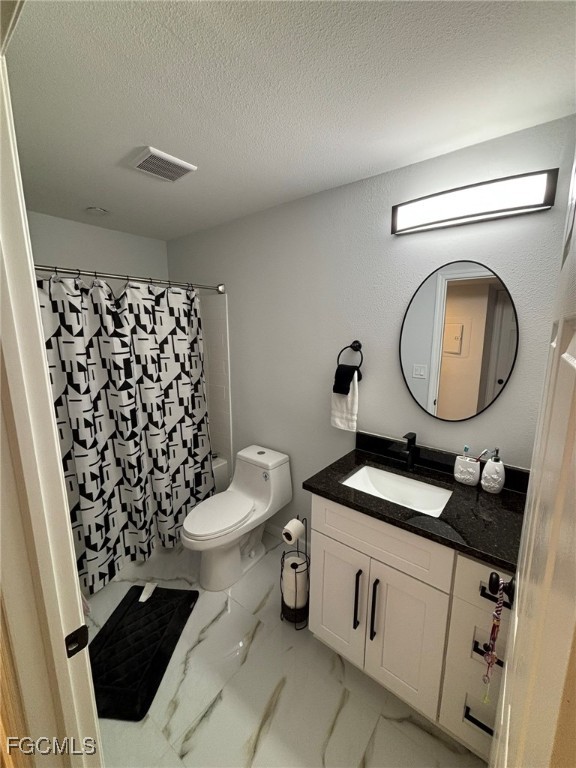 5713 Foxlake Drive, Unit 4 North Fort Myers, FL 33917 - Photo 11 of 13 a bathroom with a sink a toilet and a mirror