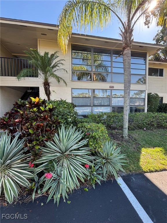 5713 Foxlake Drive, Unit 4 North Fort Myers, FL 33917 - Photo 13 of 13 a view of front door and small plants