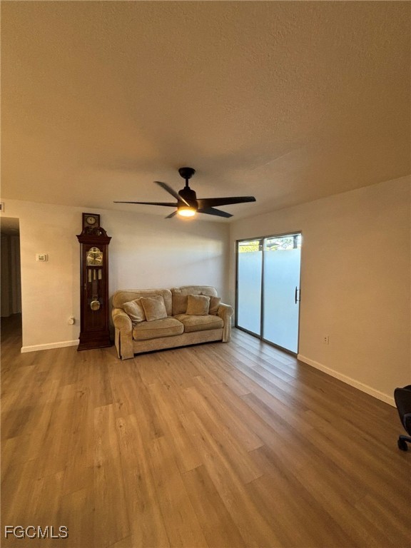 5713 Foxlake Drive, Unit 4 North Fort Myers, FL 33917 - Photo 2 of 13 a view of a livingroom with wooden floor