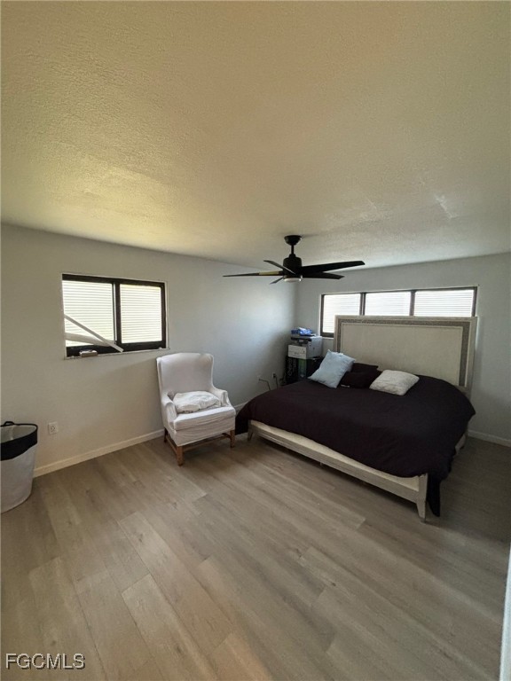 5713 Foxlake Drive, Unit 4 North Fort Myers, FL 33917 - Photo 9 of 13 a bedroom with a bed and window