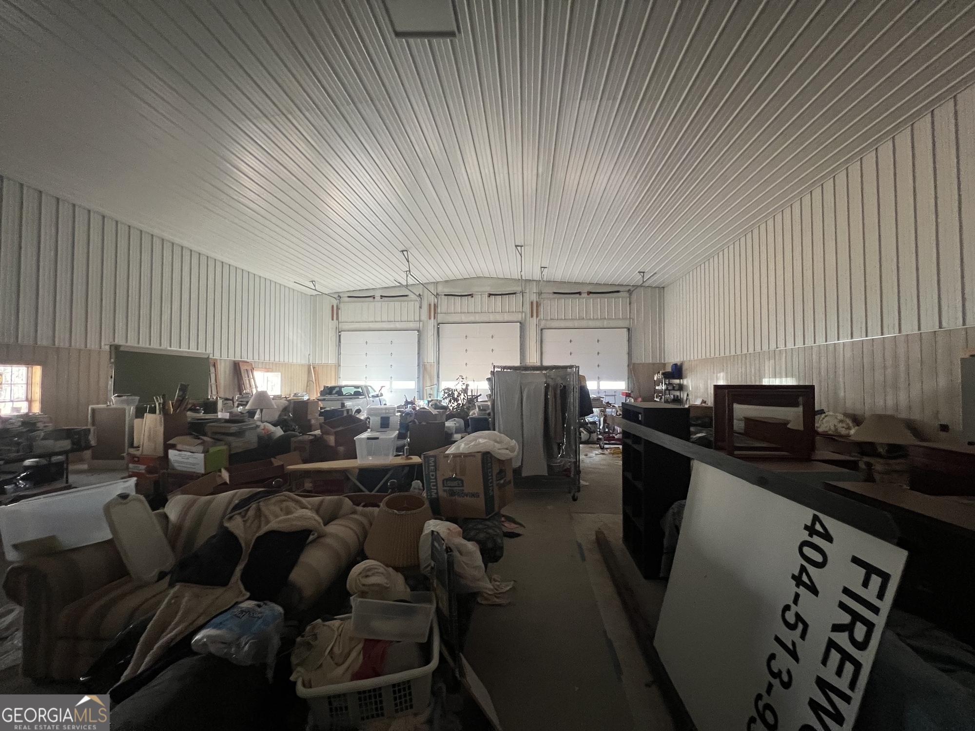 1260 Hillview Road Hampton, GA 30228 - Photo 12 of 17 a media room with lots of chairs and a projector