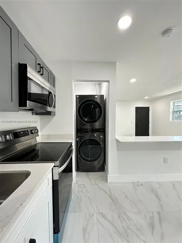 a kitchen with a stove and a microwave