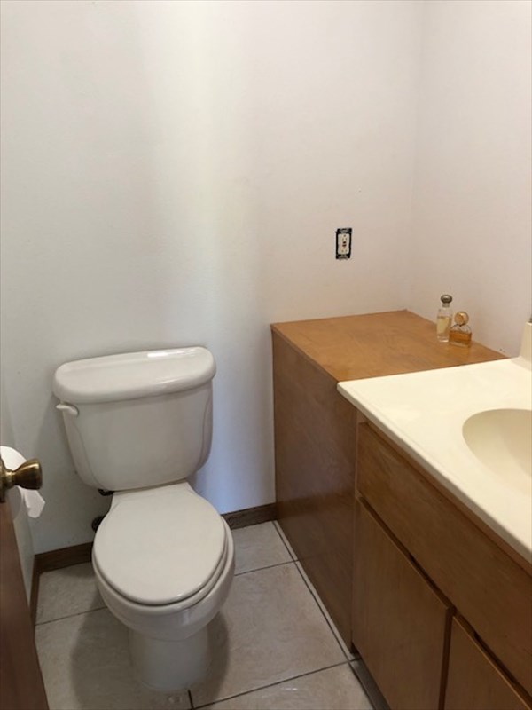 769 Ahuna Road Hilo, HI 96720 - Photo 13 of 21 a bathroom with a sink and a toilet