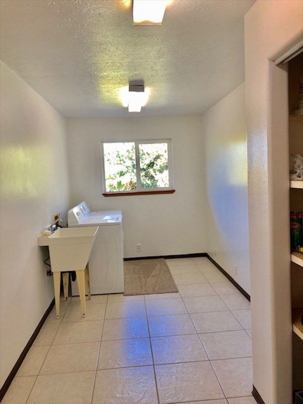 769 Ahuna Road Hilo, HI 96720 - Photo 17 of 21 a view of a room with a window and a table