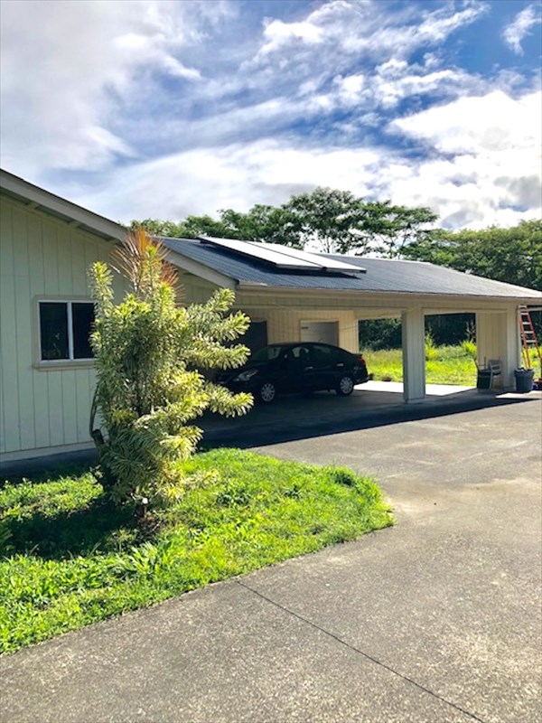 769 Ahuna Road Hilo, HI 96720 - Photo 3 of 21 a front view of a house with a yard